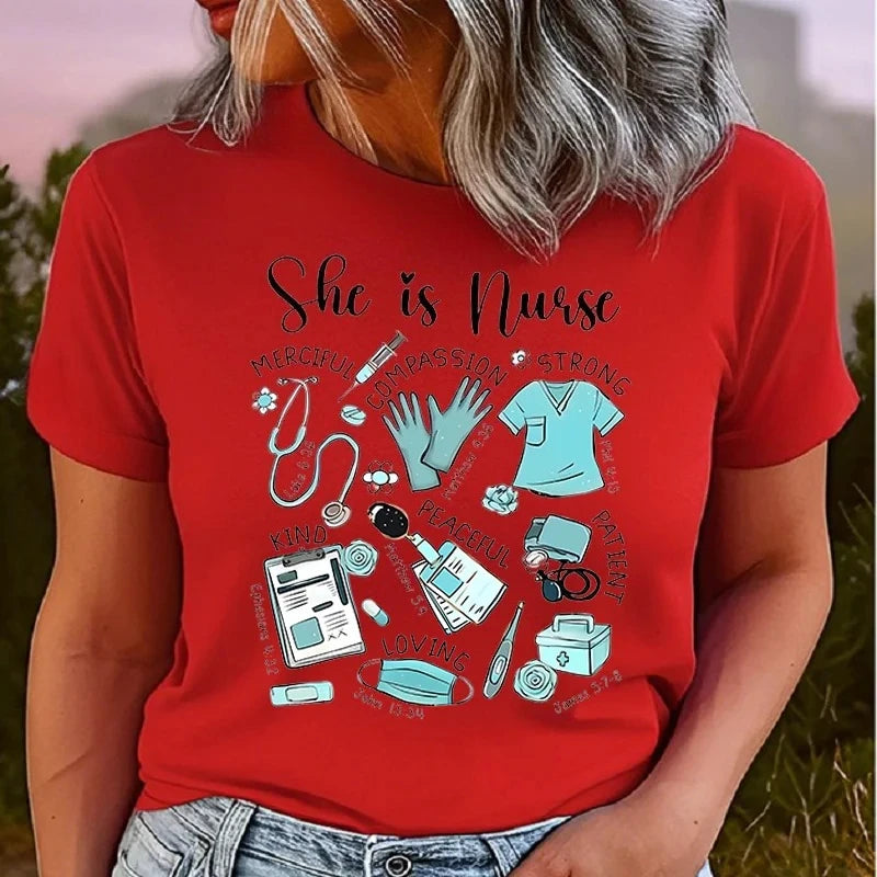 A woman wearing a red short-sleeve graphic T-shirt with the words 'She is Nurse' and medical-themed illustrations including a stethoscope, gloves, syringe, clipboard, and mask. The photo is cropped from the mouth down, showing the shirt and part of the model's hair and jeans.
