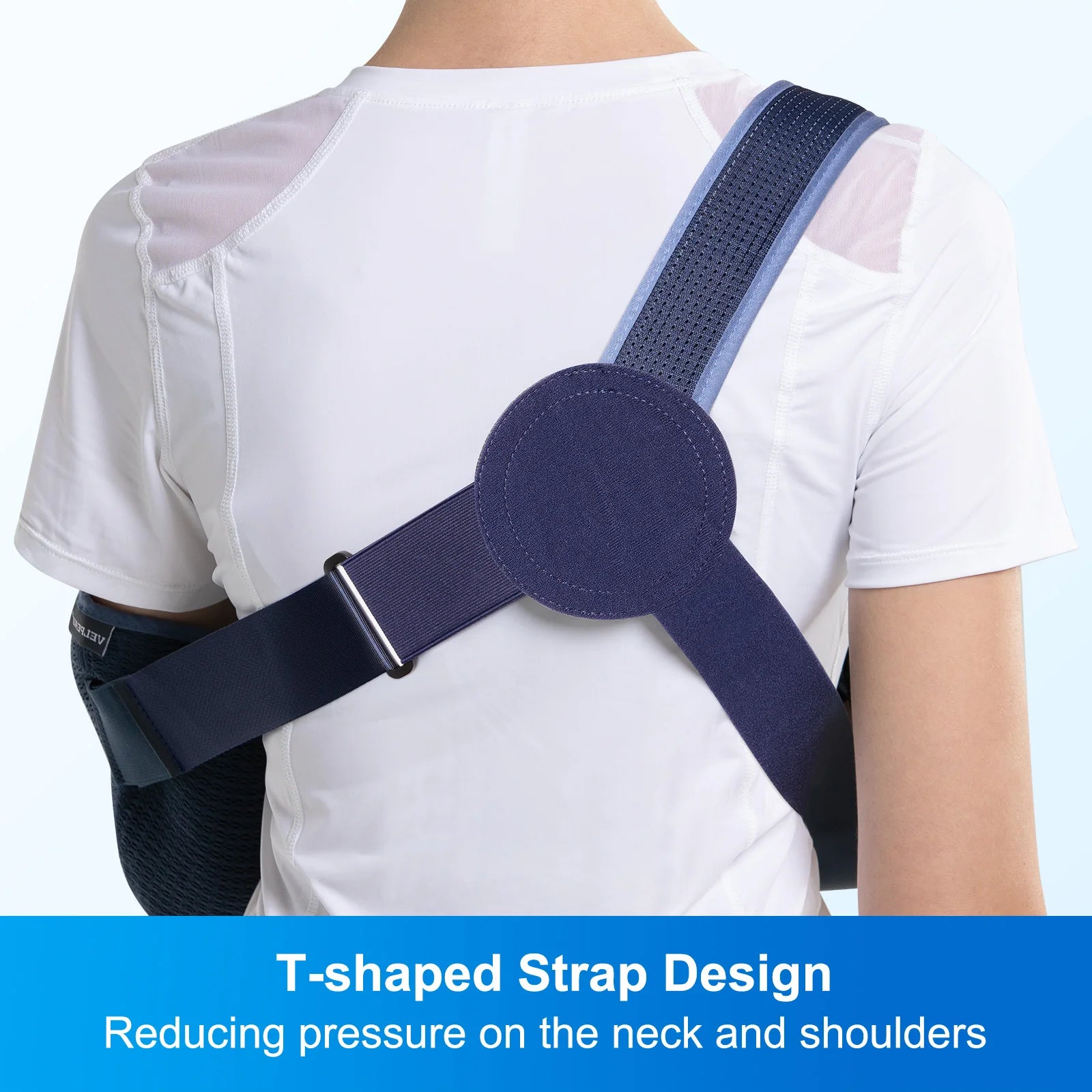 Person wearing a blue T-shaped strap shoulder support brace on a white background