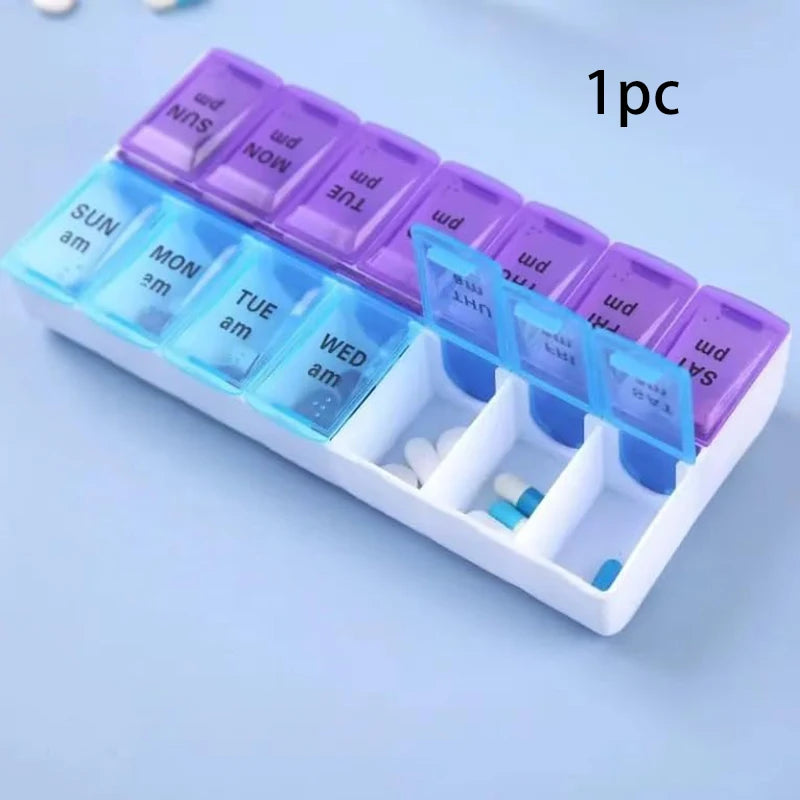 A weekly pill organizer tray with translucent compartments labeled by day of the week and AM/PM indicators, shown open with a few pills inside on a light blue background. Black text in the top right reads '1pc'.